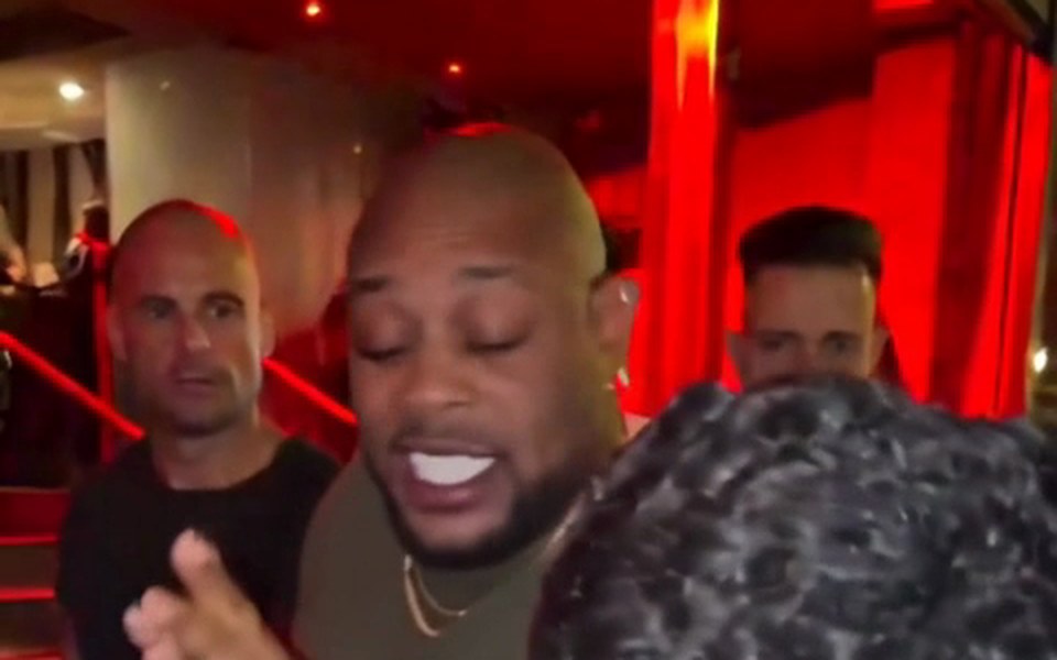 Bald man with beard in olive tee, vertical freestyle clip